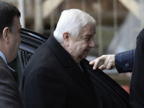 Ngoại trưởng chính phủ Syria Walid al-Moualem tới trụ sở Liên hơp quốc ở Geneva. (Nguồn: AFP/TTXVN) Phái đoàn Syria đe dọa sớm rời Hội nghị Geneva 2 ảnh 1