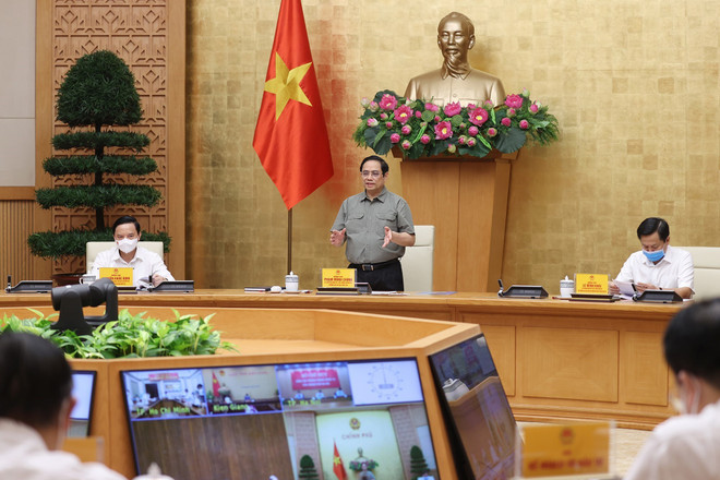 Thủ tướng Phạm Minh Chính chủ trì họp Ban chỉ đạo Quốc gia phòng, chống dịch COVID-19 với các địa phương. (Ảnh: Ảnh: Dương Giang/TTXVN) Triển khai hiệu quả phòng, chống dịch ngay tại xã, phường, thị trấn ảnh 1