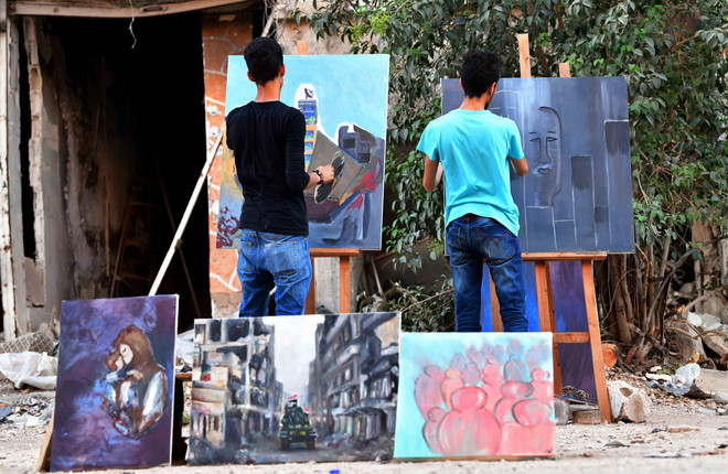Họa sỹ Syria mang sắc màu rực rỡ đến trại tị nạn Yarmouk ảnh 1