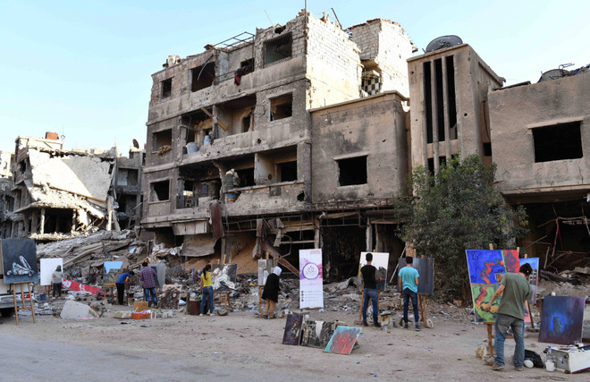 Họa sỹ Syria mang sắc màu rực rỡ đến trại tị nạn Yarmouk ảnh 3