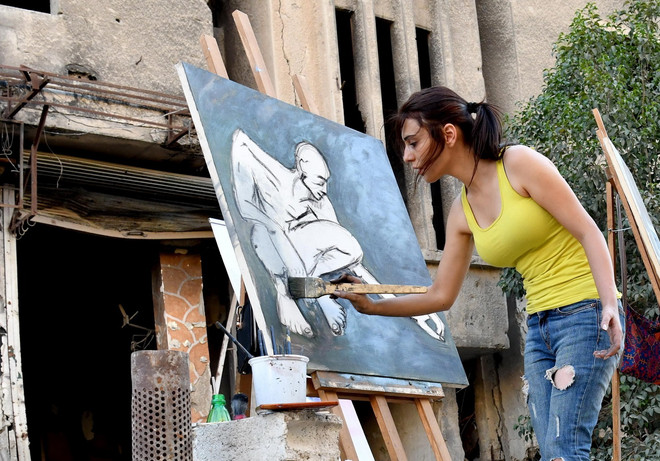 Họa sỹ Syria mang sắc màu rực rỡ đến trại tị nạn Yarmouk ảnh 4