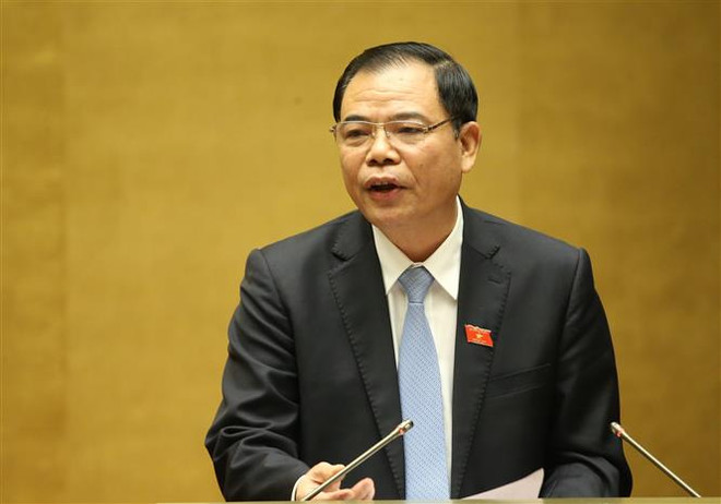 Bộ trưởng Bộ Nông nghiệp và Phát triển Nông thôn Nguyễn Xuân Cường giải trình ý kiến của các Đại biểu Quốc hội. (Ảnh: Dương Giang/TTXVN) Hoàn thiện hệ thống văn bản về phòng, chống thiên tai và đê điều ảnh 1