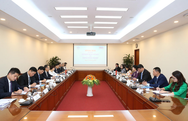 Thông tấn xã Việt Nam và Tân Hoa xã tăng cường hợp tác ảnh 2