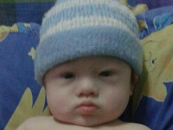 Phẫn nộ với cặp vợ chồng bỏ rơi "đứa con thuê đẻ" mắc bệnh Down ảnh 1