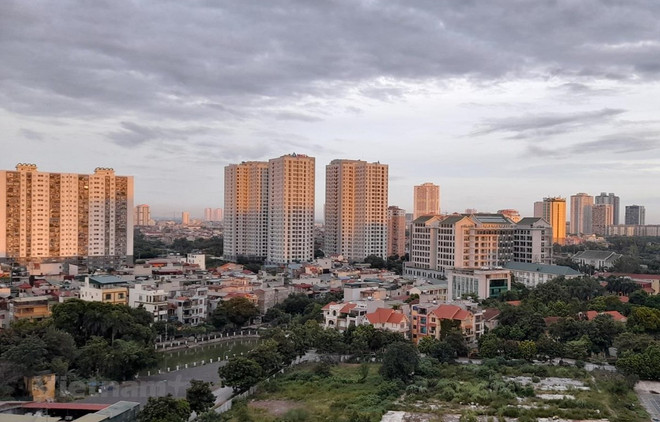 Ảnh minh họa. (Ảnh: Hùng Võ/Vietnam+) Lộ diện điểm yếu thanh khoản của thị trường bất động sản ảnh 2