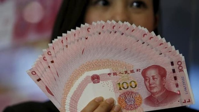 Đồng nhân dân tệ. (Nguồn: Reuters) Tỷ giá đồng NDT giảm xuống mức thấp nhất trong gần 8 năm qua ảnh 1
