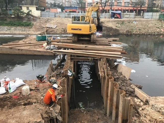Thi công gói thầu số 2 Dự án đầu tư xây dựng công trình hạ tầng xử lý nước thải Yên Xá. (Ảnh: TTXVN phát) ha_tang_xu_ly_nuoc_thai_yen_xa4.jpg