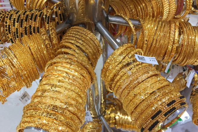 Giá vàng châu Á đi xuống trong phiên giao dịch ngày 12/4 ảnh 1