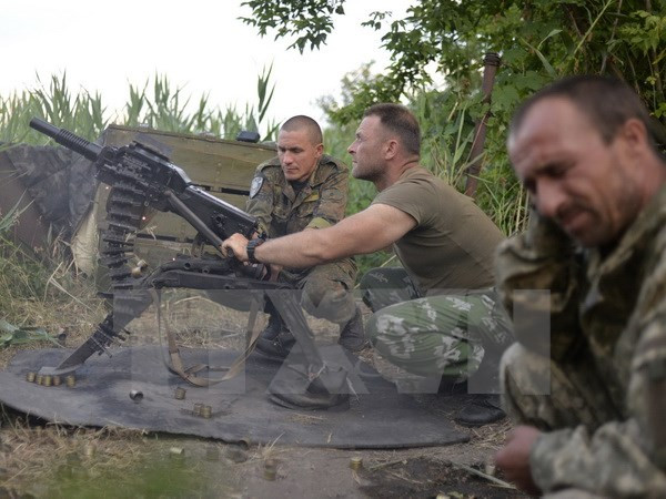 Lãnh đạo Đức, Pháp kêu gọi thực hiện đầy đủ thỏa thuận Minsk ảnh 1