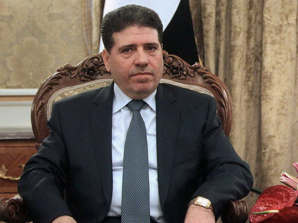 Thủ tướng Syria Wael Nader Al-Halqi. (Nguồn: AFP/TTXVN) Syria tìm kiếm sự hỗ trợ của Iran nhằm tái thiết đất nước ảnh 1