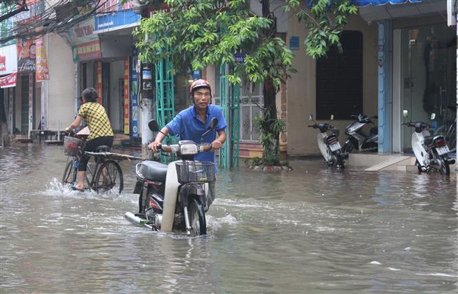 (Ảnh minh họa: Nguyễn Chinh/TTXVN) Bắc Bộ, Trung Bộ, Nam Bộ và Tây Nguyên ngày nắng, tối và đêm mưa dông ảnh 1