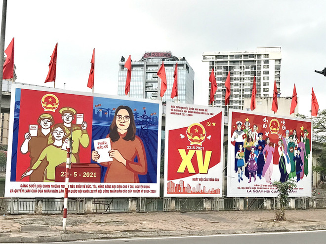 Pano tuyên truyền bầu cử. (Ảnh: Hồng Thắm/TTXVN) Bảo đảm an toàn phòng dịch COVID-19 trong ngày bầu cử Quốc hội ảnh 1