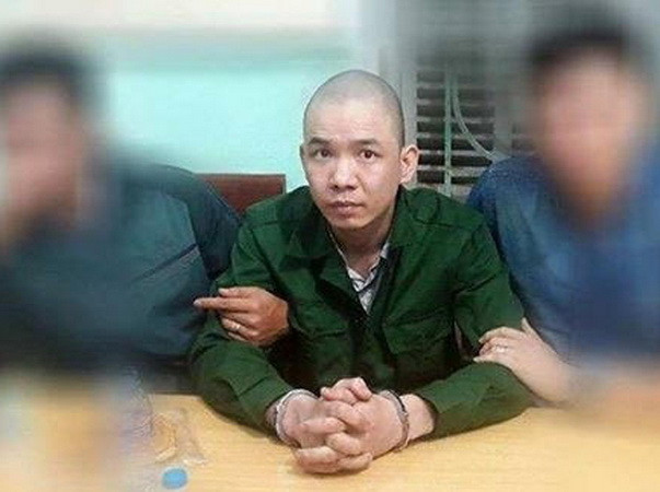 Nguyễn Văn Tình bị bắt giữ. (Ảnh: TTXVN phát) Khởi tố quản giáo và cảnh sát trong vụ 2 tử tù bỏ trốn khỏi trại ảnh 1