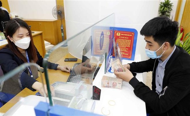 Nới "room" tín dụng, nhóm ngân hàng phân hóa đầu phiên ảnh 1