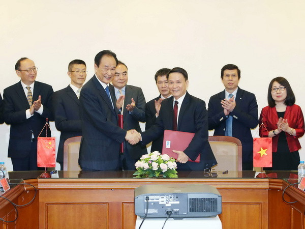 Thông tấn xã Việt Nam và Tân Hoa xã ký Thỏa thuận hợp tác mới ảnh 1