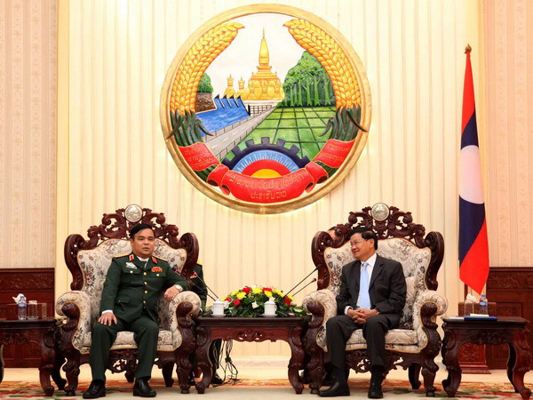Thủ tướng Lào Thongloun Sisoulith tiếp Thứ trưởng Bộ Quốc phòng Lê Chiêm Trưởng Ban công tác đặc biệt Chính phủ Việt Nam. (Ảnh: Phạm Kiên/TTXVN) Thủ tướng Lào đánh giá cao kết quả của hai Ban công tác đặc biệt ảnh 1