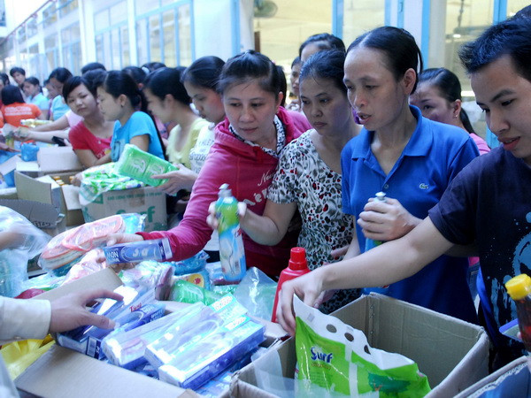 Hơn 100 DN ở khu công nghiệp TP.HCM công bố thưởng Tết ảnh 1