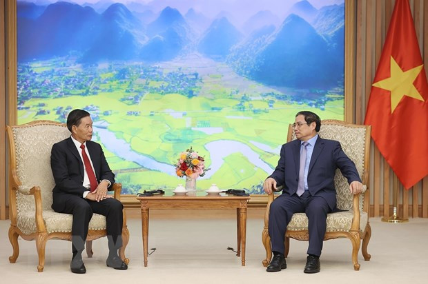 Thủ tướng Phạm Minh Chính tiếp ông Sinlavong Khoutphaythoune, Chủ tịch Ủy ban Trung ương Mặt trận Lào xây dựng đất nước. (Ảnh: Dương Giang/TTXVN) Thủ tướng: Việt Nam luôn quyết tâm kề vai sát cánh, hỗ trợ Lào ảnh 1