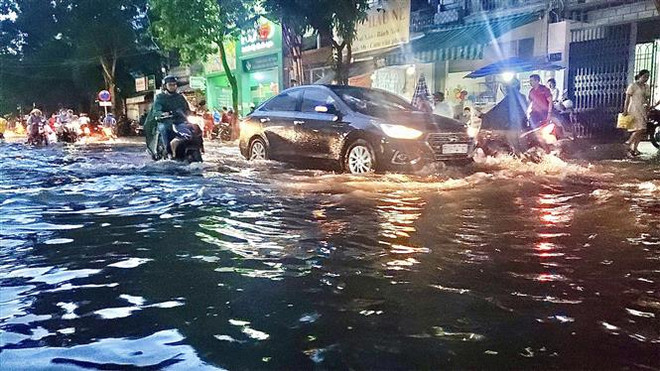 (Ảnh minh họa: Hồng Giang/TTXVN) Không khí lạnh gây mưa rét ở Bắc Bộ, TP.HCM có mưa trái mùa ảnh 1