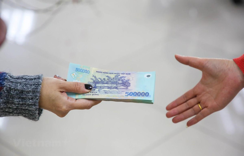 So với 12 lần điều chỉnh trước đây thì đây là lần điều chỉnh tăng lương ngày 1/7 tới là tỷ lệ tăng cao nhất trong lịch sử. T(Ảnh: PV/Vietnam+)