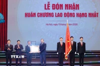 Tổng Bí thư Tô Lâm trao Huân chương Lao động hạng Nhất tặng Báo Nhân Dân. (Ảnh: Thống Nhất/TTXVN)