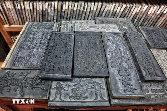 Chùa Bổ Đà còn lưu giữ bộ kinh Phật khắc trên gỗ thị được đánh giá là cổ nhất của dòng thiền Lâm Tế. (Ảnh: Danh Lam/TTXVN) ttxvn-chua-bo-da-14.jpg