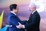Tổng thống Cộng hòa Liên bang Brazil Lula da Silva đón Thủ tướng Phạm Minh Chính. (Ảnh: Dương Giang/TTXVN)