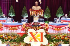 Tổng Bí thư, Chủ tịch nước Cộng hòa Dân chủ Nhân dân Lào Bounnhang Vorachith đọc diễn văn khai mạc Đại hội. (Ảnh: TTXVN phát)