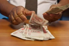 Algeria tuyên bố ngừng in tiền hỗ trợ nền kinh tế. (Nguồn: Project Syndicate)