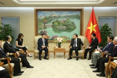 Phó Thủ tướng Trịnh Đình Dũng tiếp ông Âu Dương Vệ Dân. (Ảnh: Dương Giang/TTXVN)