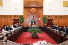 Phó Thủ tướng Thường trực Chính phủ Trương Hòa Bình tiếp ông Kamal Malhotra, Điều phối viên thường trú Liên hợp quốc và Trưởng đại diện các tổ chức Liên hợp quốc tại Việt Nam. (Ảnh: Doãn Tấn/TTXVN)