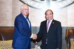 Thủ tướng Nguyễn Xuân Phúc gặp Thủ tướng Malaysia Mohd Najib bin Abdul Razak. (Ảnh: Thống Nhất/TTXVN)