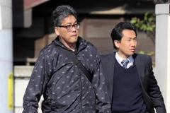 Hình ảnh nghi phạm bị bắt giữ được đăng trên tờ Asahi Shimbun. (Nguồn: Asahi)