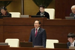 Bộ trưởng Bộ Thông tin và Truyền thông Trương Minh Tuấn trả lời chất vấn của đại biểu Quốc hội. (Ảnh: Phương Hoa/TTXVN)