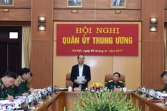 Đồng chí Trần Đại Quang, Ủy viên Bộ Chính trị, Chủ tịch nước, Ủy viên Thường vụ Quân ủy Trung ương dự và chỉ đạo hội nghị. (Ảnh: TTXVN phát)