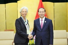 Chủ tịch nước Trần Đại Quang tiếp Tổng Giám đốc Quỹ Tiền tệ Quốc tế (IMF), bà Christine Lagarde. (Ảnh: TTXVN)