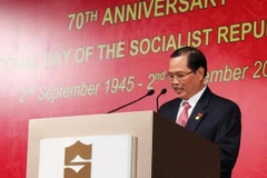 Đại sứ Việt Nam tại Singapore Nguyễn Tiến Minh đọc phát biểu khai mạc lễ kỷ niệm 70 năm Quốc khánh Việt Nam. (Ảnh: Việt Hải/Vietnam+)