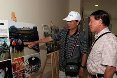 Giải ảnh báo chí 'Khoảnh khắc vàng' luôn thu hút đông đảo cộng đồng nhiếp ảnh... (Ảnh: Thông Thiện)