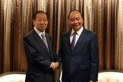 Thủ tướng Chính phủ Nguyễn Xuân Phúc tiếp Tổng Thư ký Đảng Dân chủ Tự do (LDP) cầm quyền Nikai Toshihiro. (Ảnh: Đào Thanh Tùng/TTXVN)