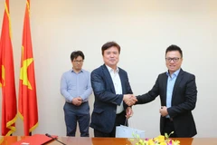 Phó Tổng giám đốc TTXVN Lê Quốc Minh tiếp ông Kwak Young-kil, Chủ tịch Aju News Corporation, Chủ tịch Tiểu ban Việt Nam thuộc Hiệp hội Doanh nghiệp vừa và nhỏ. (Ảnh: Thành Đạt/TTXVN)