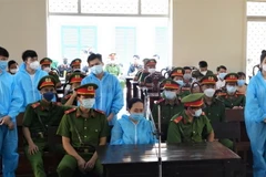 Các bị cáo nghe Hội đồng xét xử tuyên án. (Ảnh: Thanh Sang/TTXVN)