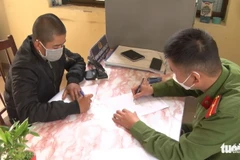 Nguyễn Anh Quốc, 39 tuổi, trú tại phường 7, thành phố Đà Lạt, tại cơ quan công an. (Nguồn: tuoitre.vn)