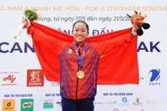 VĐV Nguyễn Thị Hương của Việt Nam giành huy chương Vàng ở nội dung thuyền đơn nữ Canoeing-WC1 500. (Ảnh: Minh Đức/TTXVN)