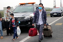 Người lao động về quê ăn Tết. (Ảnh minh họa: Văn Đức/TTXVN) 