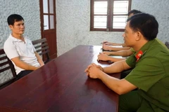 Đối tượng Huân tại cơ quan Công an. (Ảnh: Phan Quân/TTXVN)