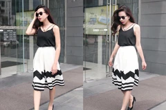 Áo hai dây và chân váy dài ngang gối cùng giày cao gót cổ điển đã đủ làm nên vẻ quyến rũ, hiện đại cho nữ giám khảo Giọng hát Việt nhí Lưu Hương Giang.