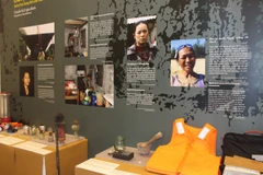 Triển lãm "Sống chung với thiên tai - Câu chuyện của người phụ nữ." (Ảnh: Hùng Võ/Vietnam+)