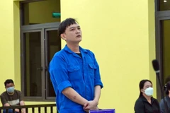 Bùi Vũ Khoa tại phiên tòa. (Ảnh: Huỳnh Anh/TTXVN)