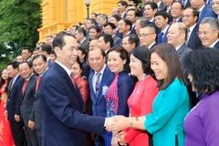 Chủ tịch nước Trần Đại Quang gặp mặt thân mật các Đại sứ, Trưởng Cơ quan đại diện ngoại giao Việt Nam ở nước ngoài. (Ảnh: Nhan Sáng/TTXVN)