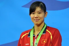 Ánh Viên với chiếc huy chương đồng thứ 2 tại ASIAD 17, năm 2014 ở Incheon, Hàn Quốc. (Ảnh Hữu Quý/TTXVN)